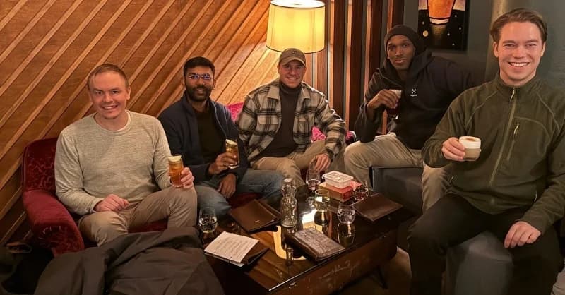 Five members of the Homie team relaxing together over drinks